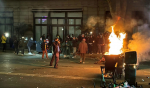 Полицейский в Тбилиси загорелся после действий протестующих